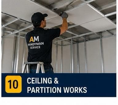 Worker installing a drywall partition in an office space