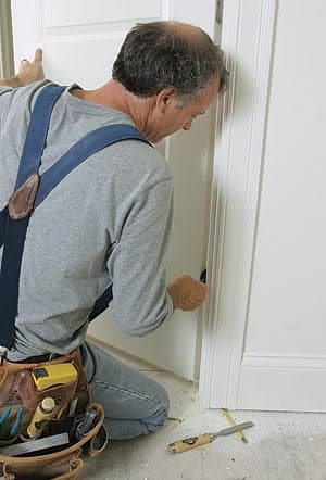 Fitting a new heavy-duty ball-bearing hinge on a main door