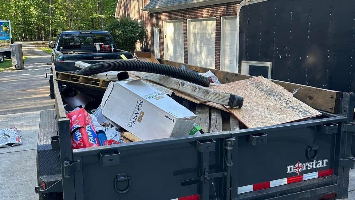 Full truckload of dismantled furniture and debris ready for disposal