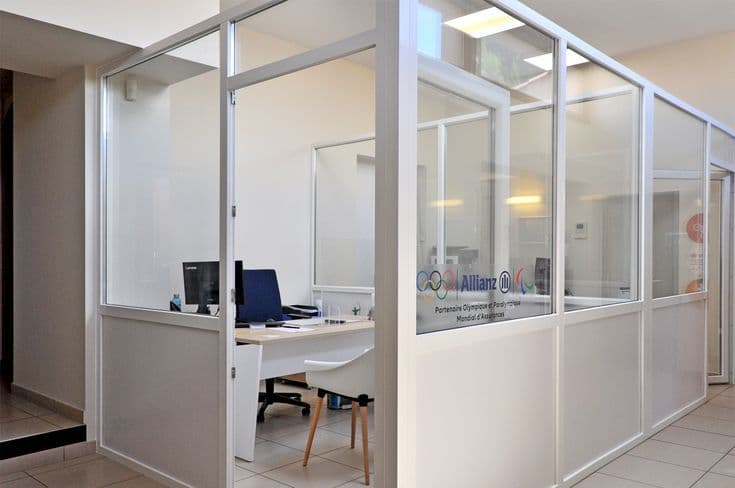 Workers dismantling office partitions during reinstatement