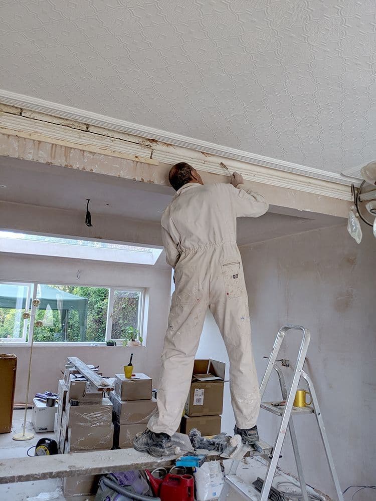 Installing a plaster cornice along a ceiling edge