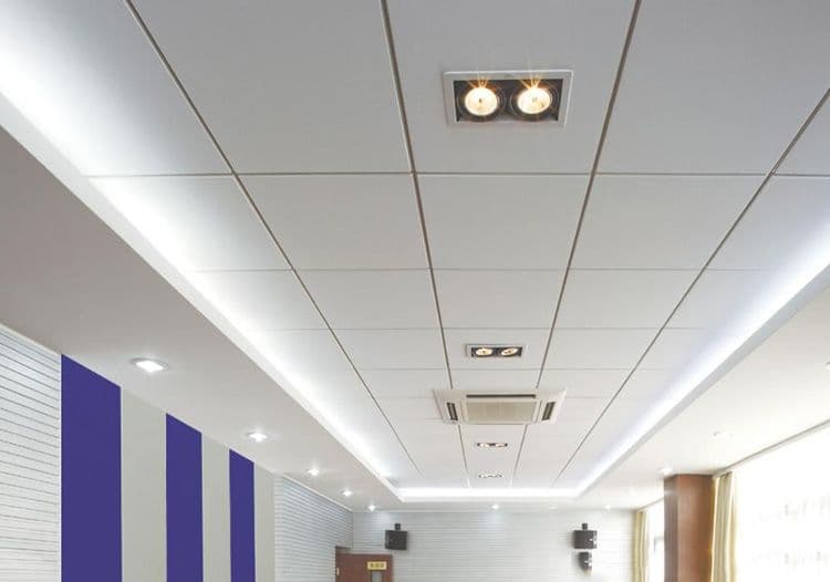 Installing acoustic mineral fibre ceiling tiles in an office